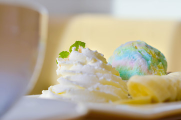 Delicious ice rainbow, brownie, cake, vanilla cream and banana in holiday.