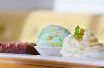 Delicious ice rainbow, brownie, cake, vanilla cream and banana in holiday.
