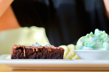 Delicious ice rainbow, brownie, cake, vanilla cream and banana in holiday.