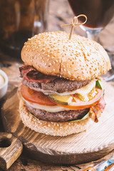 Hamburger and dark beer in vintage style