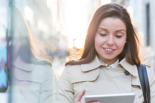 cheerful businesswoman using a tablet computer