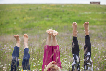 Yoga feet in grass field - 152298657
