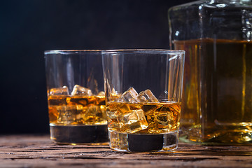 Whiskey with ice in glasses