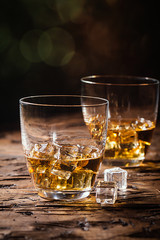Whiskey with ice in glasses