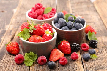 strawberry,blueberry and raspberry on wood background