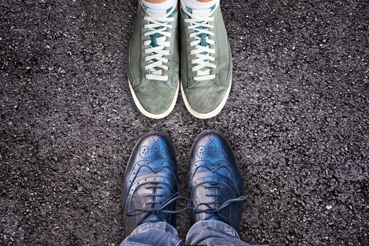 Sneakers And Business Shoes Face To Face On Asphalt, Work Life Balance Concept