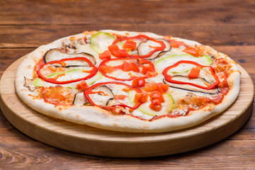 Pizza on a wooden background