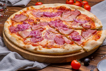 Pizza on a wooden background