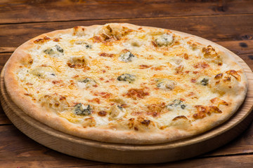 Pizza on a wooden background