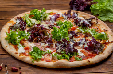 Pizza on a wooden background