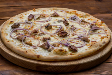 Pizza on a wooden background