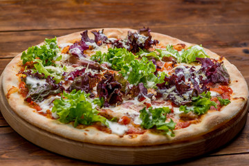 Pizza on a wooden background
