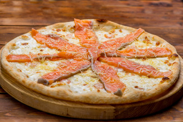 Pizza on a wooden background