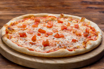 Pizza on a wooden background
