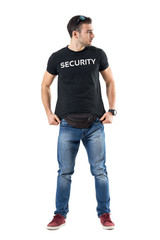 Fototapeta premium Cautious undercover police officer adjusting shirt looking away alerted. Full body length portrait isolated on white studio background. 