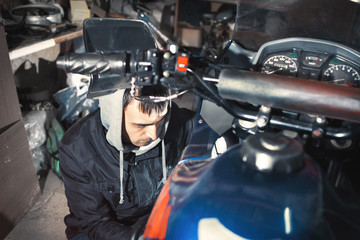 Fototapeta na wymiar Motorcycle repair in the garage