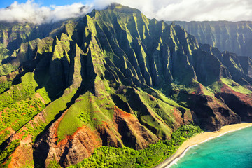 Hawaii nature travel destination. Na Pali coast on Kauai island. Helicopter aerial view of Na Pali Coast mountain landscape in Kauai island, Hawaii, USA. - obrazy, fototapety, plakaty