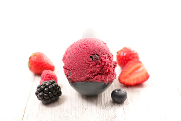 ice cream in spoon with berries