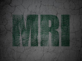 Health concept: MRI on grunge wall background