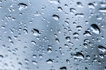 raindrops on window glass abstract background
