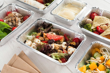 Healthy food take away, top view at wood background