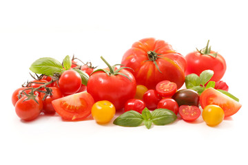 assorted colorful tomatoes on white background