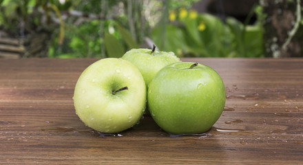Green apple on table