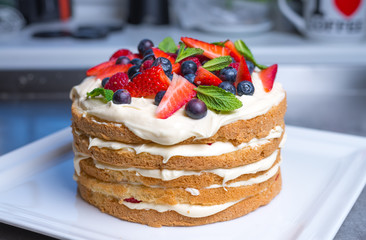 Delicious raspberry cake with fresh strawberries, raspberries, blueberry, currants 