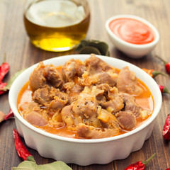 boiled chicken gizzards  with vegetables on white bowl