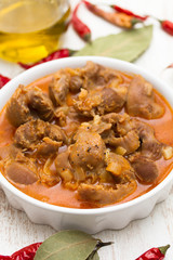 boiled chicken gizzards  with vegetables on white bowl