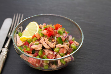 tuna salad with tomato and pepper in bowl