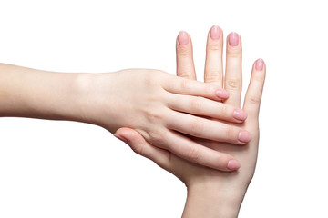 Female hands with woman's professional natursl pink nails manicure on white