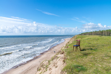 Landscape of Two Lonely chairs near sea and beautiful sky