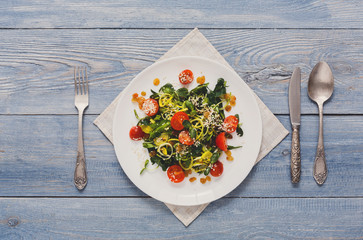 Restaurant dish - vegetable salad on rustic table