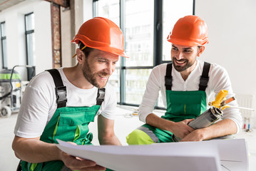 Hilarious smiling constructors keeping plan