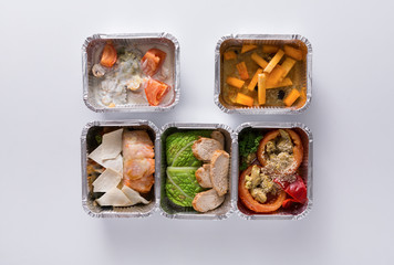 Healthy food take away in boxes on white background
