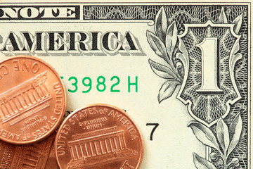 One dollar bill and coins close up