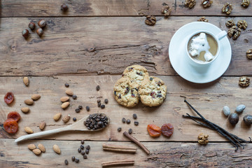 Coffee cup and varieties of nuts and other seeds.