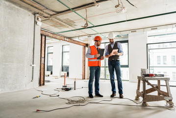 Busy builders making decisions concerning renovation