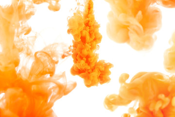 orange ink in water, abstract background