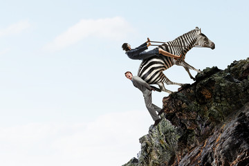 Businesswoman ride zebra. Mixed media