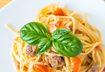 Spaghetti with sausage and cherry tomatoes