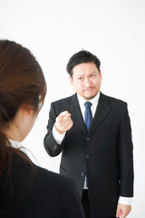 Boss angry with young business person
