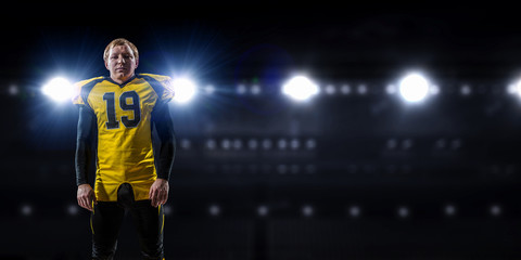 Obraz premium Football player at stadium. Mixed media