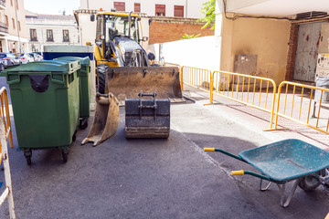 Images of works with backhoe