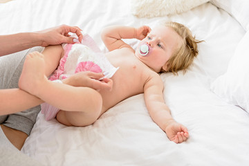 Woman wearing nappy on infant