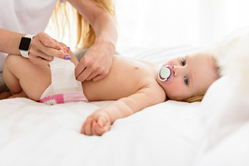 Young woman is caring of her baby