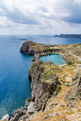 Fototapeta premium View of St Paul's Bay on a cloudy day, view from the Lindos castle, Rhodes island, Greece