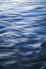 Motion blur background of the ripple surface of the blue ocean