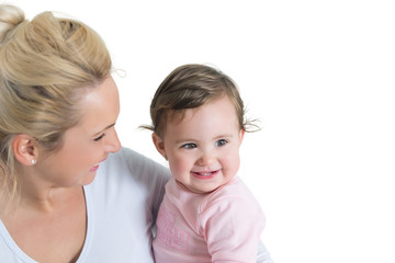 Portrait of embracing mom and baby little girl.Copy space. shallow doff, isolated on white